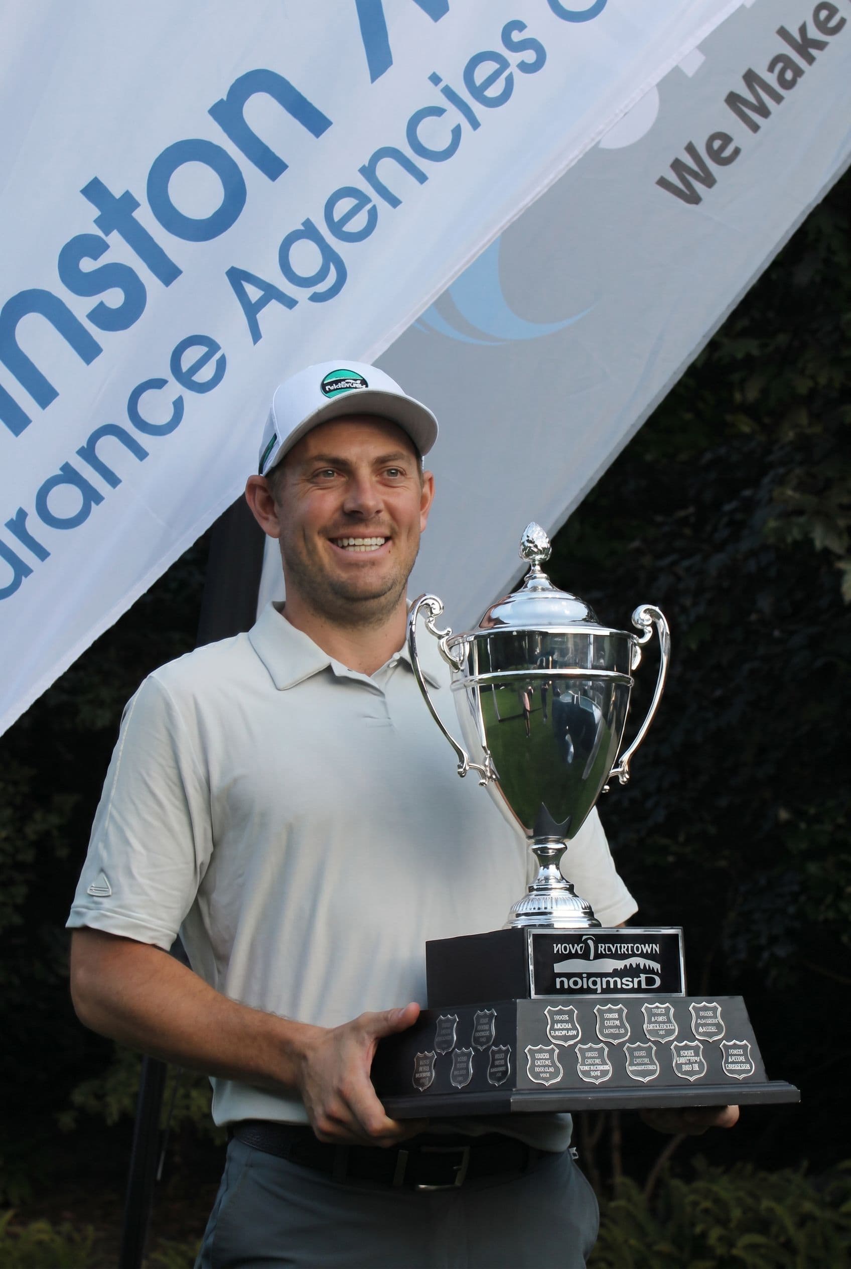Steven Lecuyer holding the Vancouver Open champion's trophy